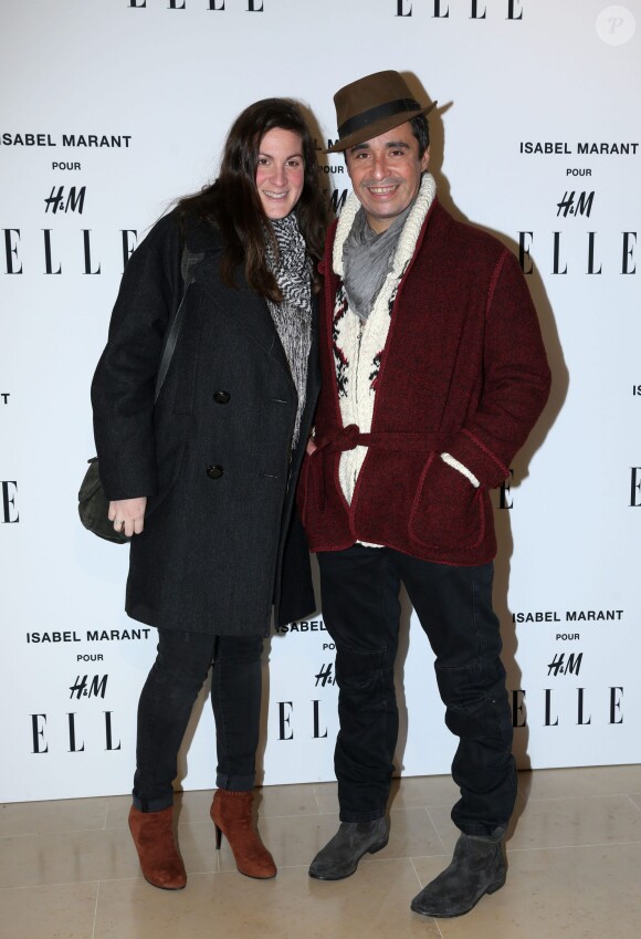 Ariel Wizman et sa compagne Osnath Assayag enceinte assistent à la soirée "Isabel Marant pour H&M" sur les Champs Elysees à Paris le 13 novembre 2013