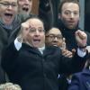 François Hollande lors de la victoire de l'équipe de France sur l'Ukraine (3-0) qui lui offre la qualification au mondial 2014 au Brésil, le 19 novembre 2013 au Stade de France à Saint-Denis, entouré de Valérie Fourneyron, Thierry Rey et Claude Sérillon