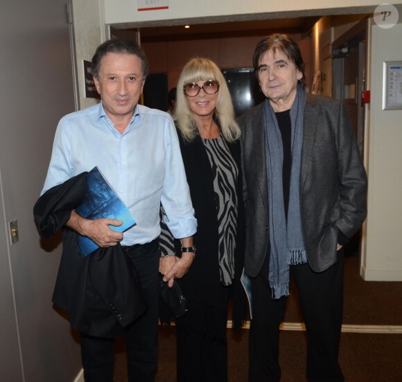 Michel Drucker, sa femme Dany et Serge Lama au spectacle Robin des bois, au Palais des Congrès à Paris, 2013.