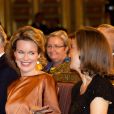  Le roi Philippe et la reine Mathilde de Belgique, en compagnie du prince Laurent et de la princesse Claire, assistaient le 11 décembre 2013 au concert de Noël au palais royal, à Bruxelles. 