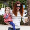 Alyson Hannigan en famille avec sa fille Keeva Jane Denisof au Brentwood Country Mart de Los Angeles, le 12 janvier 2014.