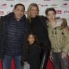 Smain, sa compagne Sid, et leurs enfants Ryan et Shanael lors du 93e Grand Prix d'Amérique à l'Hippodrome de Vincennes, le 26 janvier 2014