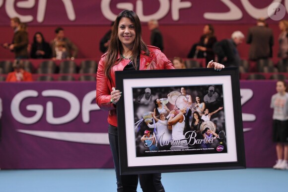Marion Bartoli lors d'un hommage que lui rendait la WTA après la finale de l'Open GDF-Suez qui opposait Anastasia Pavlyuchenkova et Sarah Errani, le 2 février 2014 au stade Pierre de Coubertin à Paris