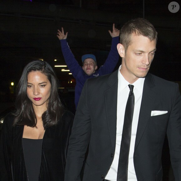 Olivia Munn et son compagnon Joel Kinnaman se rendent à l'after party de la première du film "RoboCop" à Londres le 5 février 2014.