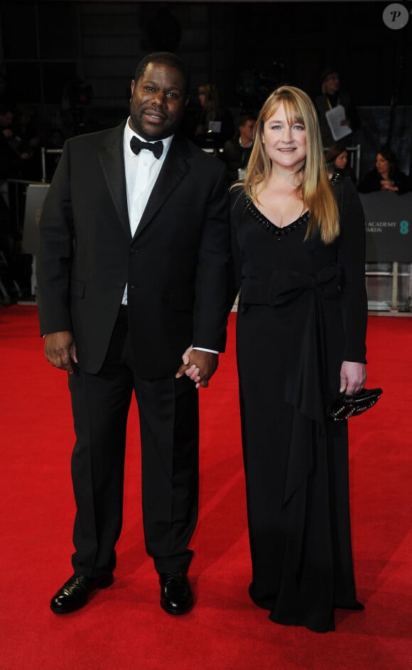 Steve McQueen et sa compagne Bianca Stigter lors de la cérémonie des BAFTA Awards à Londres le 16 février 2014