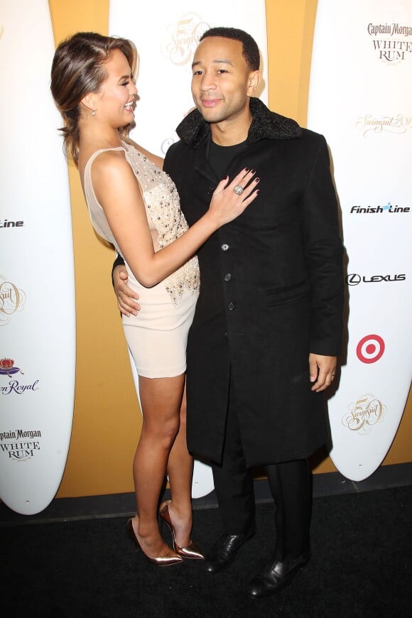 Chrissy Teigen et son mari John Legend assistent au 50e anniversaire du magazine Sports Illustrated Swimsuit. New York, le 18 février 2014.