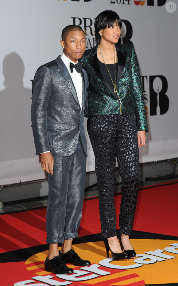 Pharrell Williams et sa femme Helen Lasichanh assistent aux Brit Awards 2014 à l'O2 Arena. Londres, le 19 février 2014.
