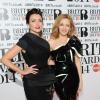 Dannii et Kylie Minogue assistent aux Brit Awards 2014 à l'O2 Arena. Londres, le 19 février 2014.