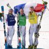 Jean-Frédéric Chapuis, Arnaud Bovolenta et Jonathan Midol sur le podium olympique de Sotchi, après avoir réalisé un triplé historique aux Jeux olympiques, le 20 février 2014
