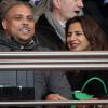 Le footballeur Ronaldo et sa compagne Paula Maurais assistent au match PSG-Valenciennes au Parc des Princes à Paris. Le 14 février 2014.