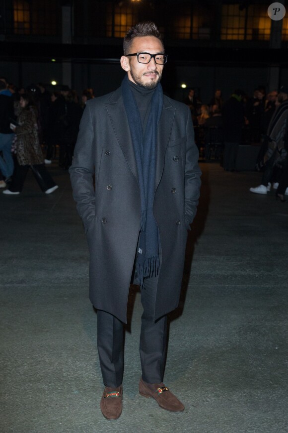 L'ex-footballeur Hidetoshi Nakata arrive au défilé Givenchy automne-hiver 2014-15, à la Halle Freyssinet. Paris, le 2 mars 2014.