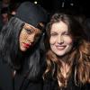 Rihanna et Laetitia Casta assistent au défilé Givenchy automne-hiver 2014-15, à la Halle Freyssinet. Paris, le 2 mars 2014.