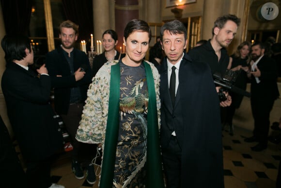 Maria Grazia Chiuri et Pierpaolo Picciolli (D.A. de Valentino) assistent à la soirée du magazine Vogue Deutsch en l'honneur de Mario Testino, au 1728. Paris, le 1er mars 2014.