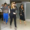 Khloé, Kim, Kourtney Kardashian et Scott Disick arrivent à l'aéroport de Miami. Le 11 mars 2014.