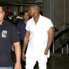 Kanye West arrive à l'aéroport de Rio de Janeiro, le 8 mars 2014.