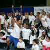 Michèle Laroqe entouré de toutes les célébrités qui avaient répondu présent pour une journée avec l'association "Enfant Star & Match" au Tennis Club de Paris le 17 mars 2014