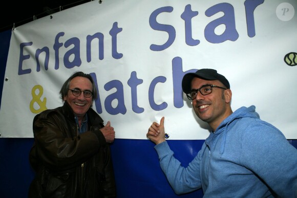Philippe Lavil et Marc Fichel lors d'une journée avec l'association "Enfant Star & Match" au Tennis Club de Paris le 17 mars 2014