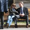 Nicolas Sarkozy et sa femme Carla Bruni se prélassent sur un banc du lycée de leur bureau de vote dans le 16e arrondissement à Paris. Le 23 mars 2014.