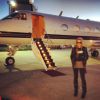 Lindsay Lohan pose devant un jet privé, le 7 mars 2014.