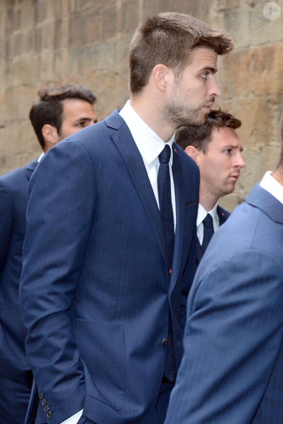 Gerard Piqué et Lionel Messi lors des obsèques de Tito Vilanova l'ex-entraîneur du Barça, en la cathédrale de Barcelone le 28 avril 2014