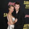 Sam Worthington, Lara Bingle à la première de "Sabotage" au cinéma "The Regal " à Los Angeles, le 19 mars 2014.