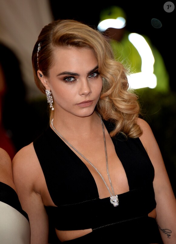 Cara Delevingne assiste au MET Gala au Metropolitan Museum of Art. New York, le 5 mai 2014.