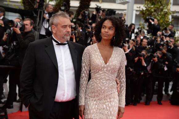 Luc Besson et Virginie Silla lors de la montée des marches du film Saint-Laurent à l'occasion du 67e Festival de Cannes, le 17 mai 2014.