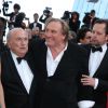Gérard Depardieu avec l'équipe du film United Passions à la montée des marches de The Homesman, à l'occasion du 67e Festival de Cannes, le 18 mai 2014.