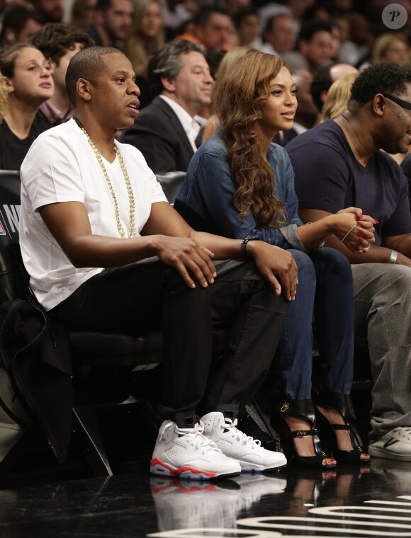 Jay-Z et Beyoncé à un match de basket des Brooklyn Nets à New York, le 12 mai 2014.