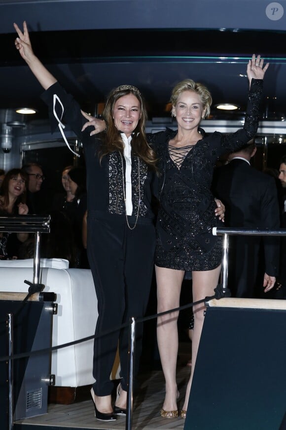 Eva Cavalli et Sharon Stone à la soirée Roberto Cavalli sur son yacht sur le port de Cannes lors du 67e Festival de Cannes le 21 mai 2014.