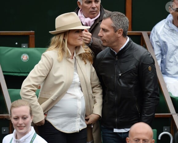Astrid Bard et Yann Delaigue, futurs parents comblés lors du quatrième jour des Internationaux de France à Roland-Garros, le 28 mai 2014 à Paris