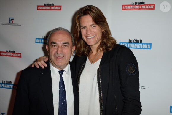 Jean Gachassin et Amélie Mauresmo lors de la soirée Sport & Philanthropie au Club des Loges à Paris, le 28 mai 2014