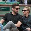 Audrey Lamy et son compagnon Thomas dans les tribunes du tournoi de Roland-Garros à Paris, le 1er juin 2014.