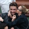 Audrey Lamy et son compagnon Thomas dans les tribunes du tournoi de Roland-Garros à Paris, le 1er juin 2014.