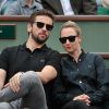 Audrey Lamy et son compagnon Thomas dans les tribunes du tournoi de Roland-Garros à Paris, le 1er juin 2014.