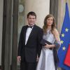 Manuel Valls et sa femme Anne Gravoin lors du banquet à l'Elysée donné en l'honneur de la reine Elizabeth II, Paris, le 6 juin 2014.