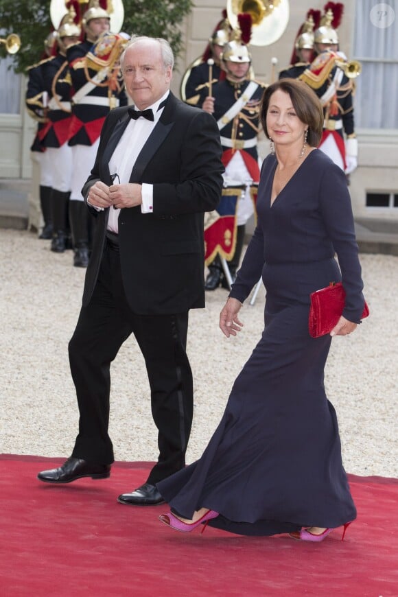 Hubert Védrine et sa femme lors du banquet à l'Elysée donné en l'honneur de la reine Elizabeth II, Paris, le 6 juin 2014.