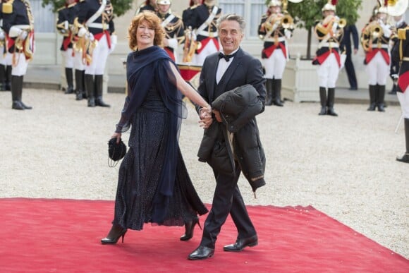 Gérard Holtz et sa femme Muriel Mayette-Holtz lors du banquet à l'Elysée donné en l'honneur de la reine Elizabeth II, Paris, le 6 juin 2014.