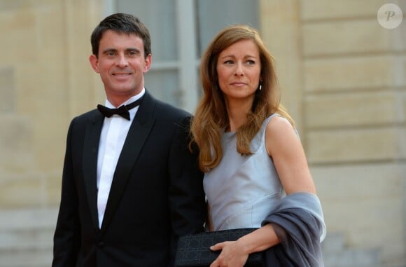 Manuel Valls et Anne Gravoin lors du banquet à l'Elysée donné en l'honneur de la reine Elizabeth II, Paris, le 6 juin 2014.