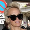 Pamela Anderson arrive avec son mari Rick Salomon à l'aéroport de Nice pour le festival de Cannes. Le 13 mai 2014.
