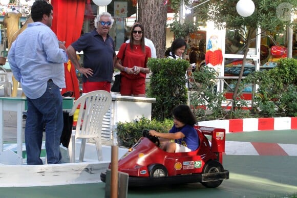 Flavio Briatore, ému au côté d'Elisabetta Gregoraci de voir son fils Nathan Falco prendre le volant d'une voiture de course dans les rues de Marina di Pietrasanta, le 7 juin 2014