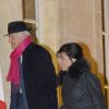 Pierre Nora et Anne Sinclair arrivent au Palais de l'Elysée à Paris le 9 décembre 2013.