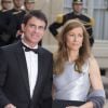 Manuel Valls et sa femme Anne Gravoin lors du banquet à l'Elysée donné en l'honneur de la reine Elizabeth II, Paris, le 6 juin 2014.