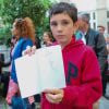 Exclusif - Nathan, fier de sa dédicace de Sempé - Vernissage de l'exposition "Les vacances du petit Nicolas" à la mairie du 4ème à Paris le 18 juin 2014.