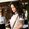 Rihanna quitte le restaurant Il Pastaio à Beverly Hills, habillée d'un t-shirt d'inspiration baseball et d'une jupe Givenchy et d'un sac Louis Vuitton (modèle Alma BB, à damier ébène). Los Angeles, le 17 juin 2014.