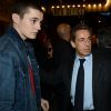 Nicolas Sarkozy et son fils Louis sortant du Town Hall où Carla Bruni vient de donner un concert, à New York le 24 avril 2014.