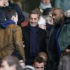 Louis Sarkozy et Nicolas Sarkozy au Parc des Princes pour un match du PSG, le 2 mars 2014.