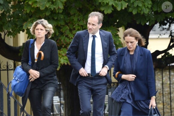 Anne Fauconnier, Fabien Namias et Catherine Nay assistent aux obsèques de Benoît Duquesne, à l'église Jeanne d'Arc de Versailles, le jeudi 10 juillet 2014.