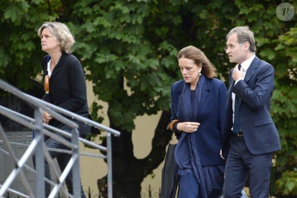 Anne Fauconnier, Fabien Namias et Catherine Nay assistent aux obsèques de Benoît Duquesne, à l'église Jeanne d'Arc de Versailles, le jeudi 10 juillet 2014.