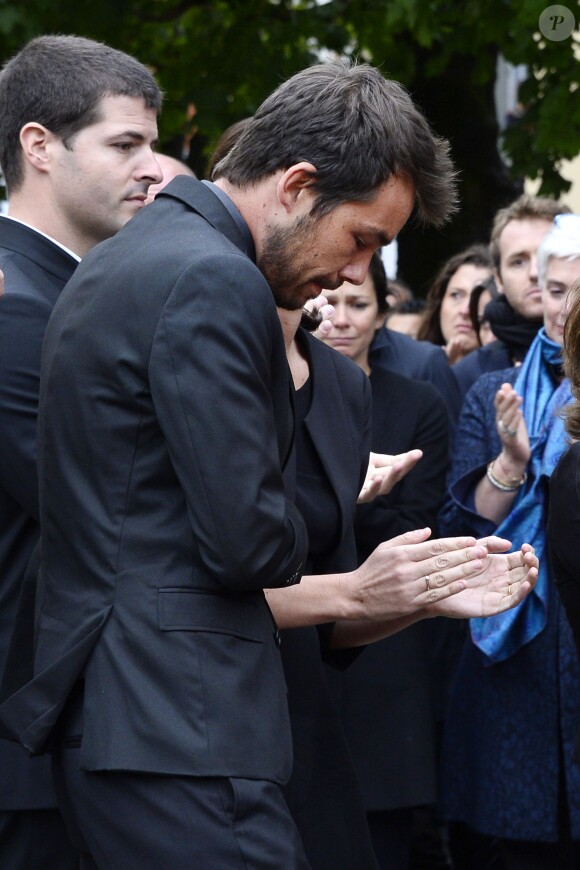 Les fils de Benoît Duquesne aux obsèques de leur père en l'église Jeanne-d'Arc de Versailles, le 10 juillet 2014.